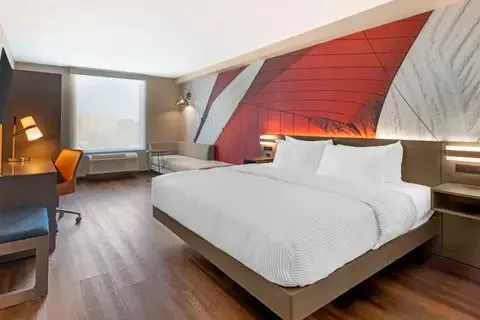 Standard King room with king bed and work desk
