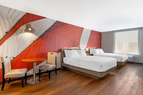 Two Queen Efficiency Suite with two beds and kitchenette